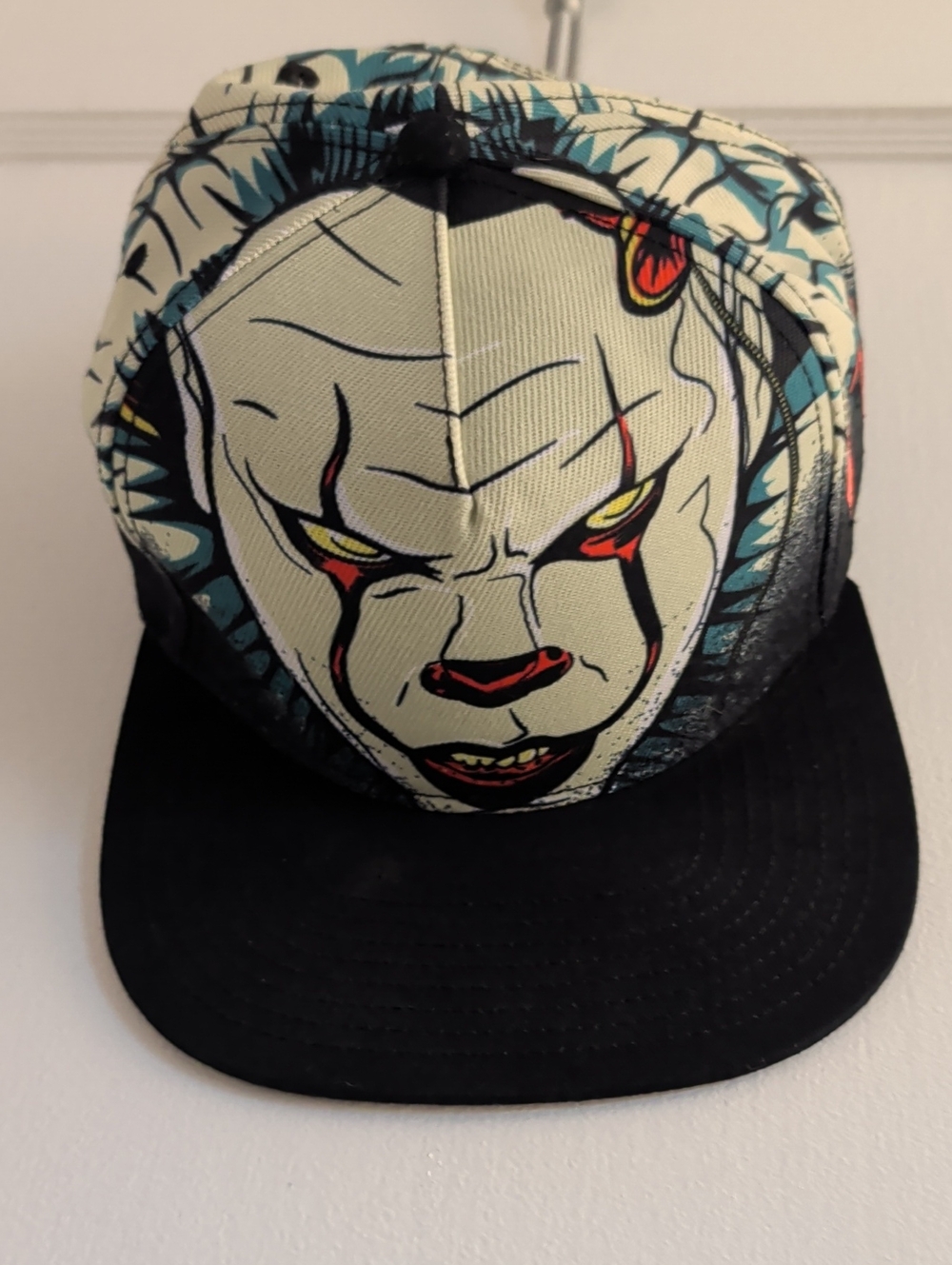 Pennywise IT Graphic Snapback Hat with Clown Face in Black & Cream